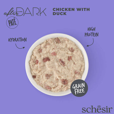 Schesir After Dark Chicken with Duck canned cat food pate in white bowl on purple background, high-protein and grain-free.