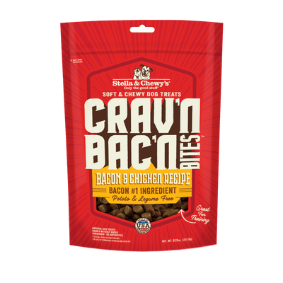 Stella & Chewy’s Crav’n Bac’n Bites dog treats packaging featuring bacon and chicken recipe, potato-free and legume-free, made in the USA.