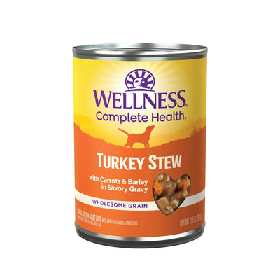 Wellness Complete Health Turkey Stew canned dog food with carrots, barley, and savory gravy in a 12.5 oz can.