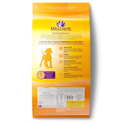 Wellness Complete Health Just For Puppy dry food with chicken, oatmeal, and salmon meal