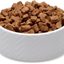 White bowl filled with soulmate freeze-dried dog food on a white background