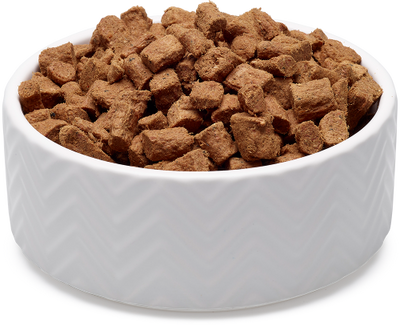 White bowl filled with soulmate freeze-dried dog food on a white background