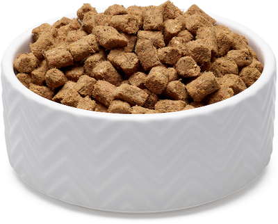 White bowl filled with soulmate roar roar roar seafood recipe brown dog food on a white background