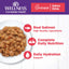 Wellness Complete Health Salmon Dinner canned cat food with real salmon, offering complete nutrition and daily hydration.
